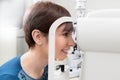 Smiling Woman Patient Having a refractor Exam Royalty Free Stock Photo